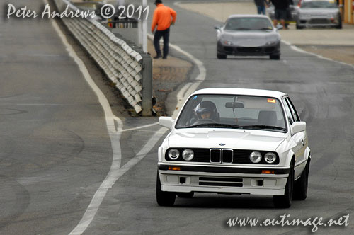 Not just for the boys! A young Asian woman driving an E30 BMW 318is at Wakefield Park Goulburn, NSW Australia. Circuit Club Day April 25, 2011. Photo copyright Peter Andrews, Outimage Australia.