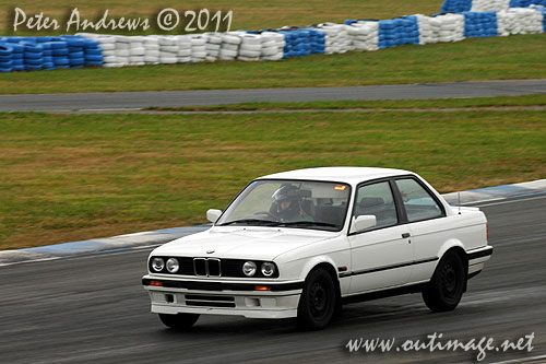 Not just for the boys! A young Asian woman driving an E30 BMW 318is at Wakefield Park Goulburn, NSW Australia. Circuit Club Day April 25, 2011. Photo copyright Peter Andrews, Outimage Australia.