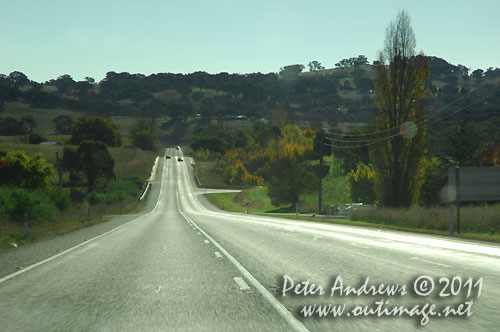 On the Mitchell Highway, driving into the sun. Photo copyright Peter Andrews, Outimage Australia.