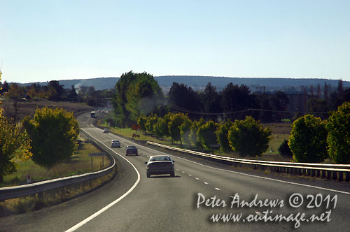 On the Mitchell Highway, driving into the sun. Photo copyright Peter Andrews, Outimage Australia.