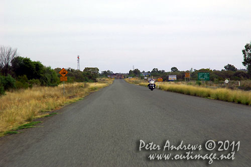 A lone biker heading out of Cobar on the Barrier Highway, NSW Australia. Photo copyright Peter Andrews, Outimage Australia.