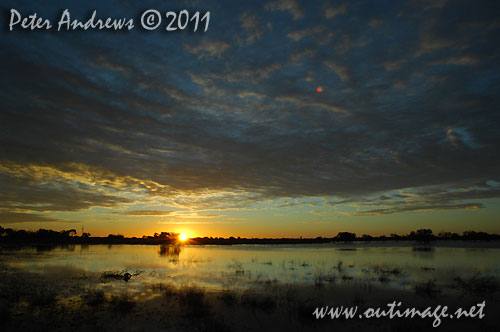 Sunset near the Little Topar Roadhouse, between Wilcannia and Broken Hill on the Barrier Highway, NSW Australia. Photo copyright Peter Andrews, Outimage Australia.