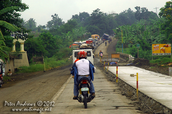 Another trucking disaster at a roadworks site along the highway to Kidapawan City, Davao del Sur Province, Mindanao, Philippines. Photo copyright Peter Andrews, Outimage Australia.