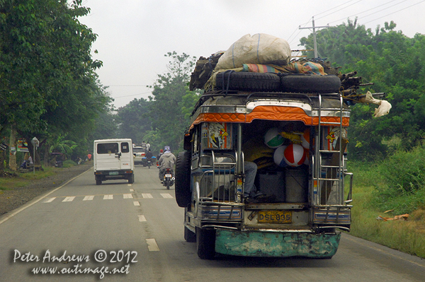 No room left in this jeepney on the highway to Kidapawan City, Davao del Sur Province, Mindanao, Philippines. Photo copyright Peter Andrews, Outimage Australia.