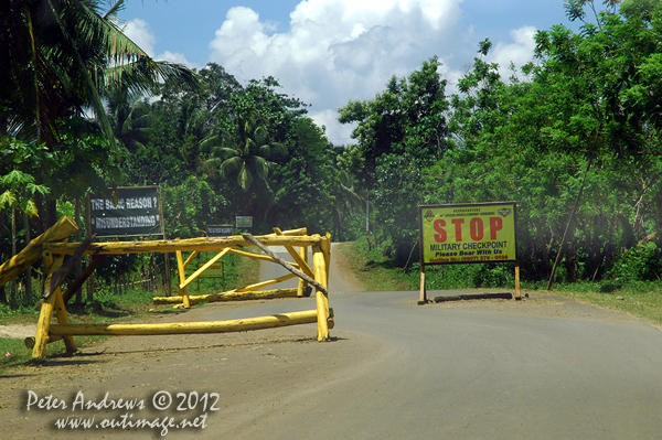 A military checkpoint along the Paco Roxas - Arakan Road, Cotabato Province, Mindanao, Philippines. Photo copyright Peter Andrews, Outimage Australia.