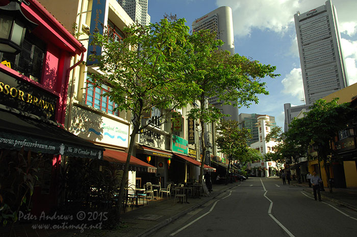 Circular Road runs right through one of the key restaurant and bar districts of Singapore at Boat Quay, Walking through late in the afternoon just before office workers descend from the towers of the banking, financial and other multinational business sectors that loom behind the classic shophouse buildings of Boat Quay, there is a sensation of the place just starting to come alive as it prepares for another busy evening of trade. Photo © Peter Andrews / Outimage. Walking from Circular Road to Chinatown in Singapore as the city prepares for the Lunar New Year.