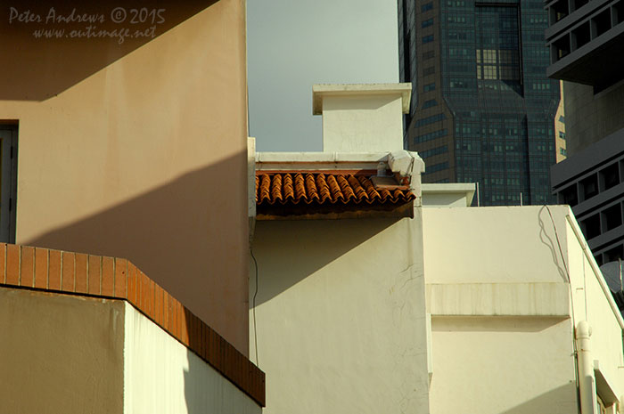 Mixed architecture of the old overshadowed with the new, along Lorong Telok in the Boat Quay area of Singapore city. Photo © Peter Andrews / Outimage. Walking from Circular Road to Chinatown in Singapore as the city prepares for the Lunar New Year.