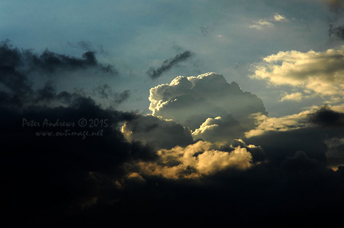 Evening storm clouds building up over the mountains surrounding Davao City, Mindanao, seen from Paradise Island Beach on Samal Island.