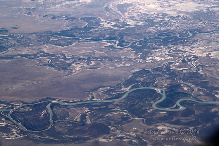 The Bynoe and Flinders Rivers wind their way towards the Gulf of Carpentaria, near Normanton in outback Queensland. 17°45'24.0"S 140°53'07.0"E. High altitude shots from a flight between Sydney Australia and Manila, Philippines.