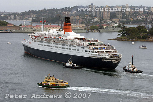 QE2 with Sydney's Garden Island Naval Dockyard in the background.