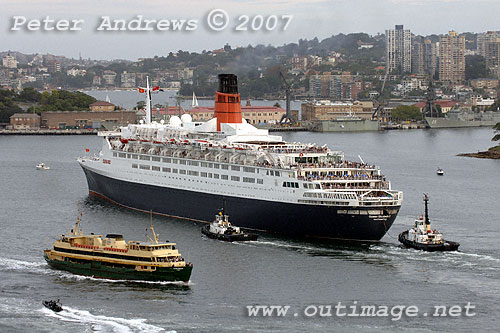 QE2 with Sydney's Garden Island Naval Dockyard in the background.