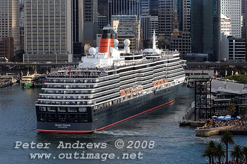 With no assistance from tugs, Queen Victoria uses her own bow and stern thrusters to clear the wharf of the Overseas Passenger Terminal at Circular Quay.