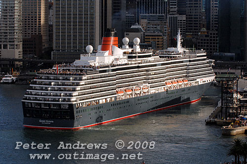 Queen Victoria uses her own bow and stern thrusters to clear the wharf at Circular Quay.