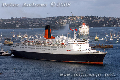 Queen Elizabeth II with Queen Victoria in the background leaving Sydney Harbour.