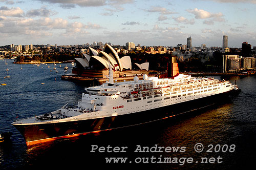 Queen Elizabeth II in position to go astern into Circular Quay with the Sydney Opera House in the background.