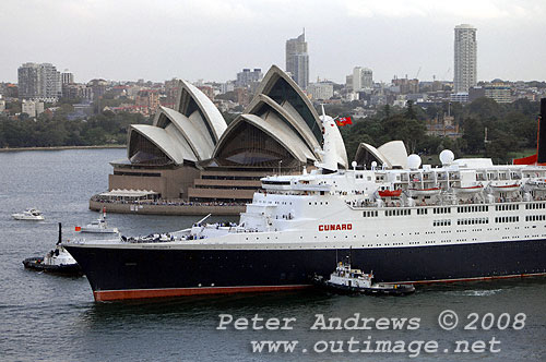 Queen Elizabeth 2 in front of the Sydney Opera House on Sydney Harbour.