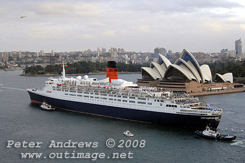 Queen Elizabeth 2 in front of the Sydney Opera House on Sydney Harbour.