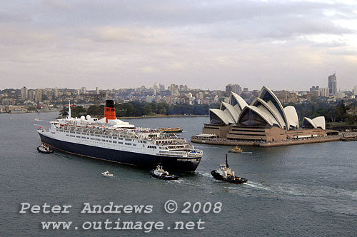 Queen Elizabeth 2 in front of the Sydney Opera House on Sydney Harbour.