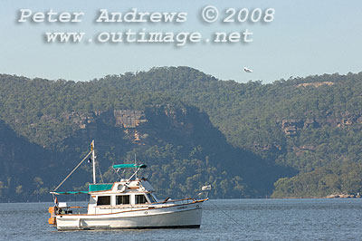 Roanoke, a 1975 32 Heritage CL at anchor off Peat's Bite with the seaplane now airborn and flying back to Rose Bay, Sydney Harbour.