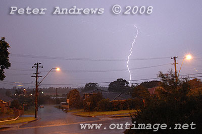 Lightning hits ground near the beach.