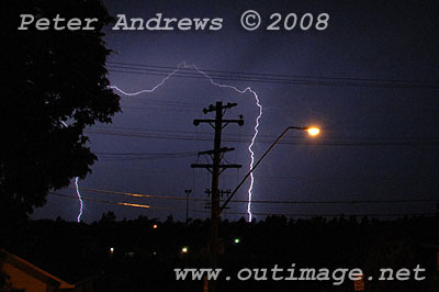 Lightning hits ground near the beach.