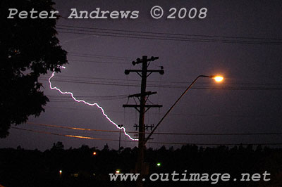 Lightning hits ground near the beach.