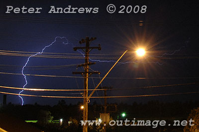 Lightning hits ground near the beach.