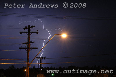 Lightning hits ground near the beach.