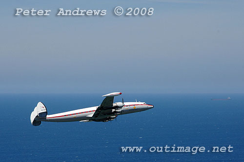 The Illawarra based Historical Aircraft Restoration Society's (HARS) Lockheed Super Constellation, Connie, flying over Stanwell Park, NSW Australia. Photo copyright Peter Andrews.