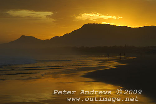 Illawarra's Corrimal Beach at sunset with Mount Kembla left and Mount Keira right, in the background. Photo copyright Peter Andrews, Outimage.