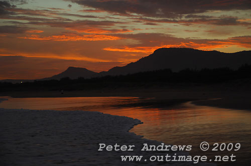 Illawarra's Corrimal Beach at sunset with Mount Kembla left and Mount Keira right, in the background. Illawarra's Corrimal Beach at sunset. Photo copyright Peter Andrews, Outimage.