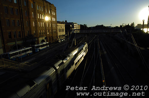 Evening train to Sydney leaving Newcastle. Photo copyright Peter Andrews, Outimage Publications.