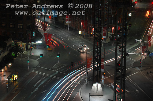 Late night traffic flowing into Broadway from Pitt Street at Sydney's Railway Square. Photo copyright Peter Andrews 2008, Outimage Publications.
