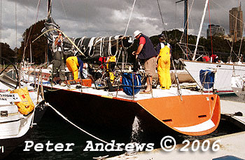 Crew on Infinity III preparing to leave the dock as a strong southerly front seen in the background approaches from down the coast.