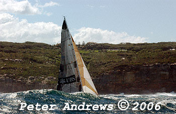 Geoff Lavis' Inglis 50 UBS Wild Thing, behind a wave at the heads after the start of the 2006 Sydney to Gold Coast Yacht Race.