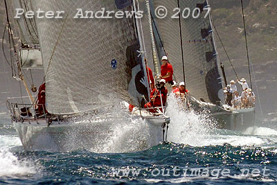 Bob Oatley's Wild Oats ahead of Mike Slade's City Index Leopard, both now outside the heads of Sydney Harbour.