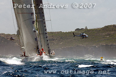 Bob Oatley's Wild Oats ahead of Mike Slade's City Index Leopard, both now outside the heads of Sydney Harbour.