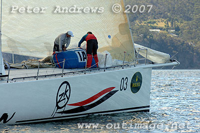 Repacking sails after another sail change on Ichi Ban.