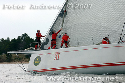 Crew prepare  for another sail change.