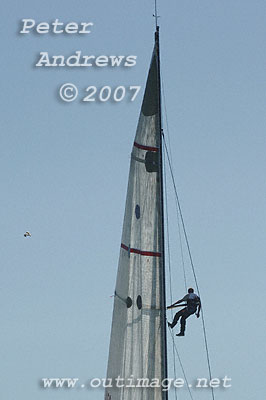 Tasmanian bowman Justin Clougher aloft on Rosebud searching any ripple out on the water ahead and breeze that may help the boat to get moving towards Hobart.