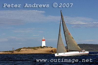 Roger Sturgeon's Transpac 65 Rosebud passes the Iron Pot Lighthouse to enter the Derwent River.