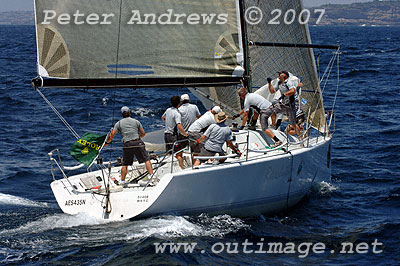 Jeff Carter's Revolution Edake setting their spinnaker for their final leg down to the finish.