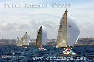 The Farr 40's under spinnaker running down to the finish of Race 1, clouds of an impending change seen in the weather in the background.