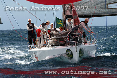 Ivan Wheen's Sputnik running down to the line under spinnaker.