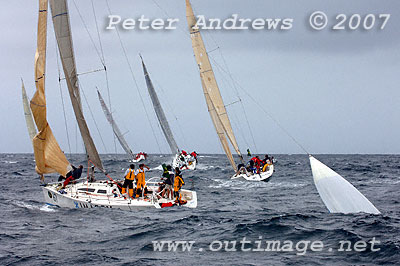 Marc and Louis Ryckmans' Imarex - (Yeah Baby), experiencing problems with a spinnaker after rounding the top mark during the first race of the day. The picture shows the spinnaker in the water behind the boat, acting like sea anchor.