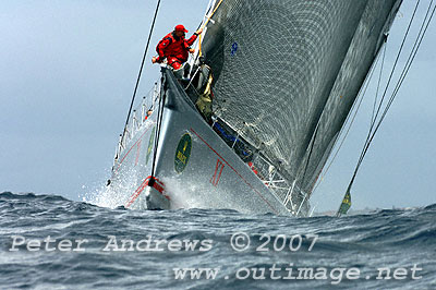 Bob Oatley's Wild Oats XI climbing a wave near the top mark.