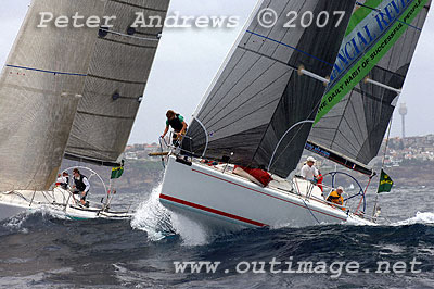 Skipper Ed Psaltis' AFR Midnight Rambler launching of a wave at the top mark of Race 1.