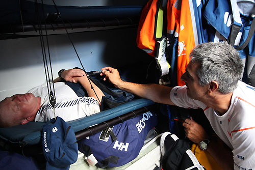 Horacio Carabelli playing joke on Phil James on Ericsson 4 on leg 1 of the Volvo Ocean Race. Photo copyright Guy Salter - Ericsson 4 - Volvo Ocean Race.