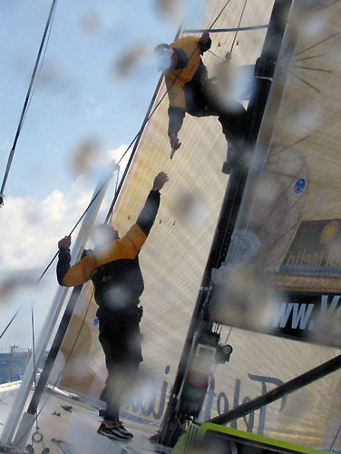 Teamwork on Telefonica Blue with Bowman / Trimmer / Driver Pepe Ribes and Trimmer / Driver Xabi Fernandez performing boat maintenance. Photo copyright Gabriele Olivo - Equipo Telefonica Blue.