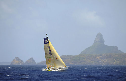 Telefonica Black passes through the scoring gate at Fernando de Noronha, on leg 1 of the Volvo Ocean Race. Photo copyright Rick Tomlinson / Volvo Ocean Race.